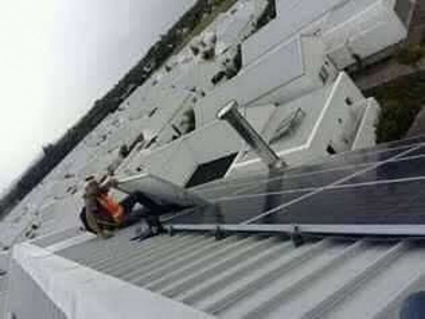 Top of Club house building East direction. (1 of two identical building structures with 60kw of Canadian solar panels spread throughout the two buildings roof tops. That's me at the top end there.. Fair Cape.